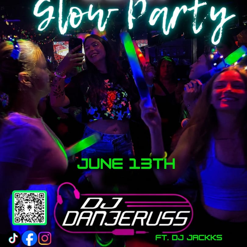 People dancing at a glow party with neon lights, holding glow sticks, and smiling.