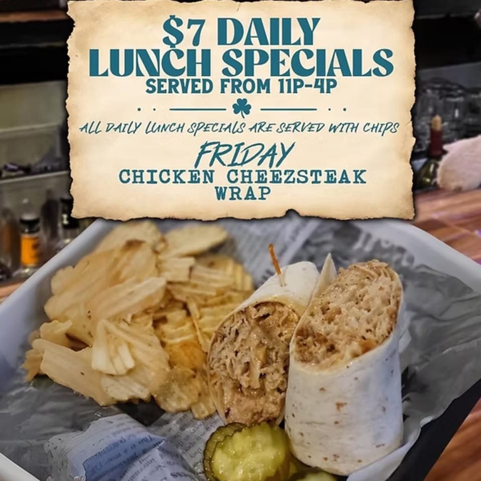 Gleasons Bar's Friday lunch special: a chicken cheesesteak wrap with chips and pickles.