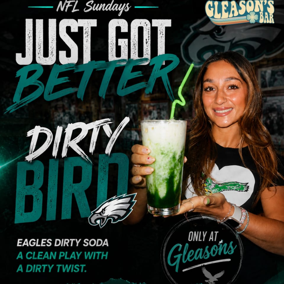 Woman holding a green layered drink at Gleason’s Bar, promoting an Eagles-themed NFL Sunday dirty soda.
